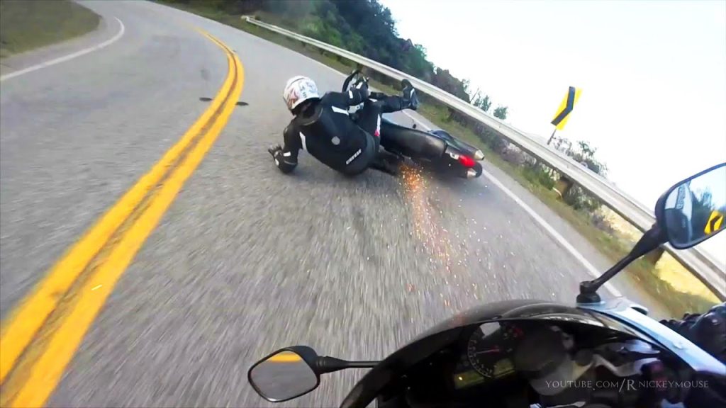 Lowside crash into a guardrail