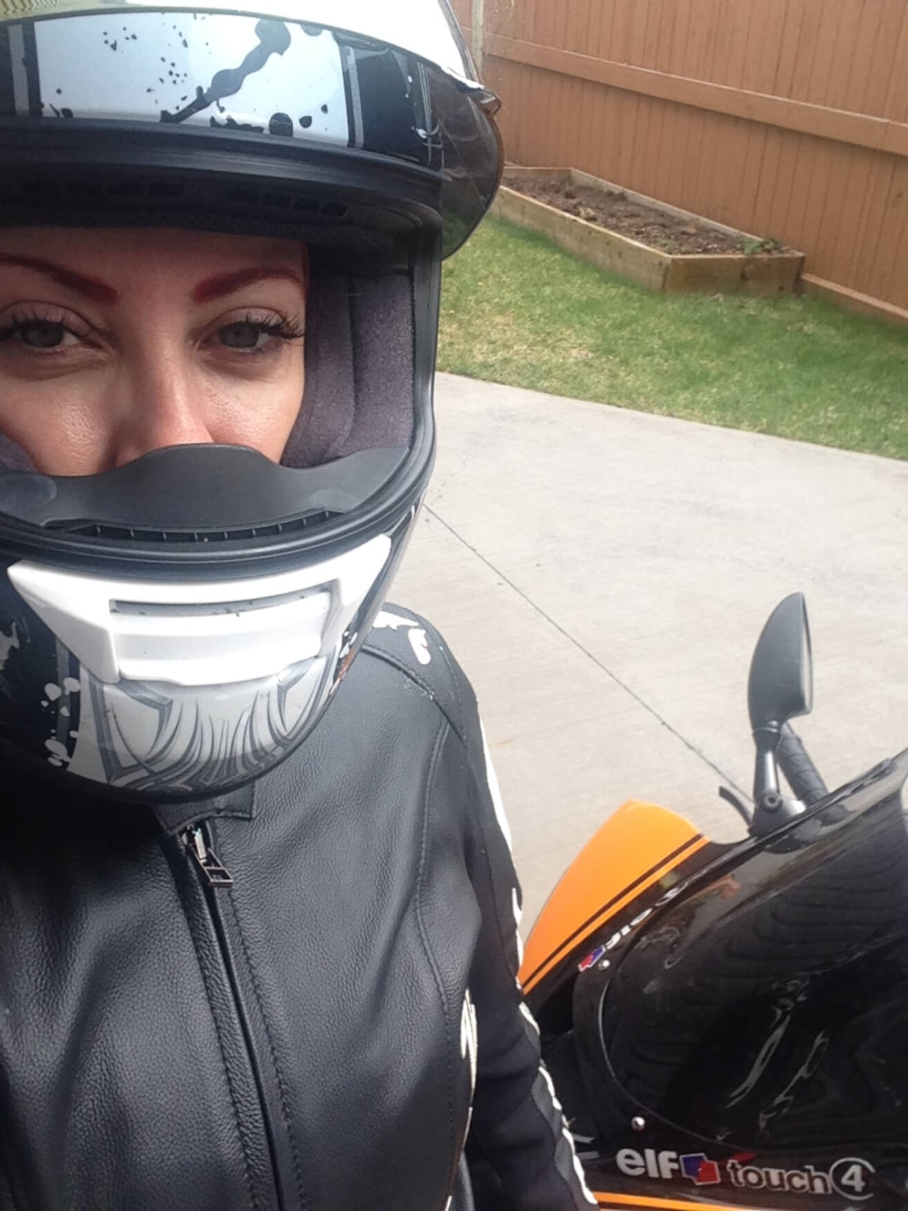 Jennifer Angelina (JA Motogeek) getting ready to ride to class.