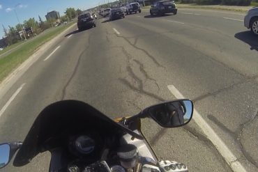Motorcyclist's birds eye view of the road and cars around them