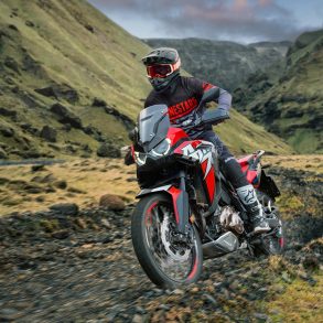 Rider on adventure motorcycle with chain drive