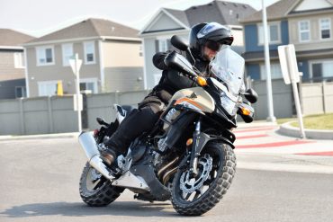 2016 Honda CB500X turning in a traffic circle.