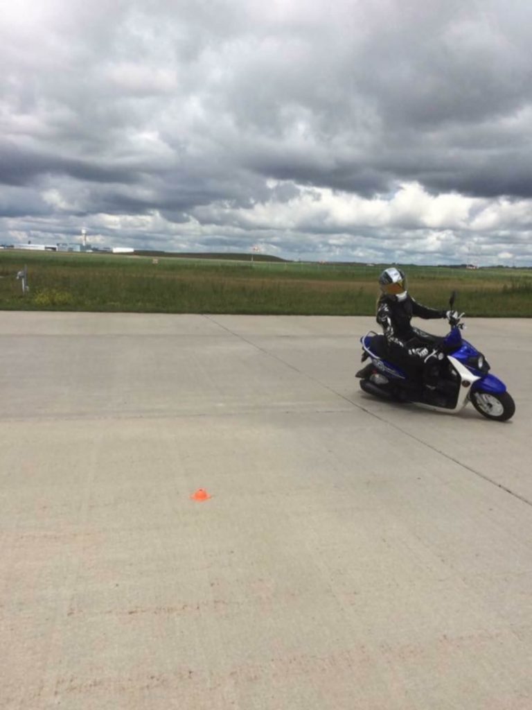 Jennifer Angelina giving a demo on the scooter of countersteering