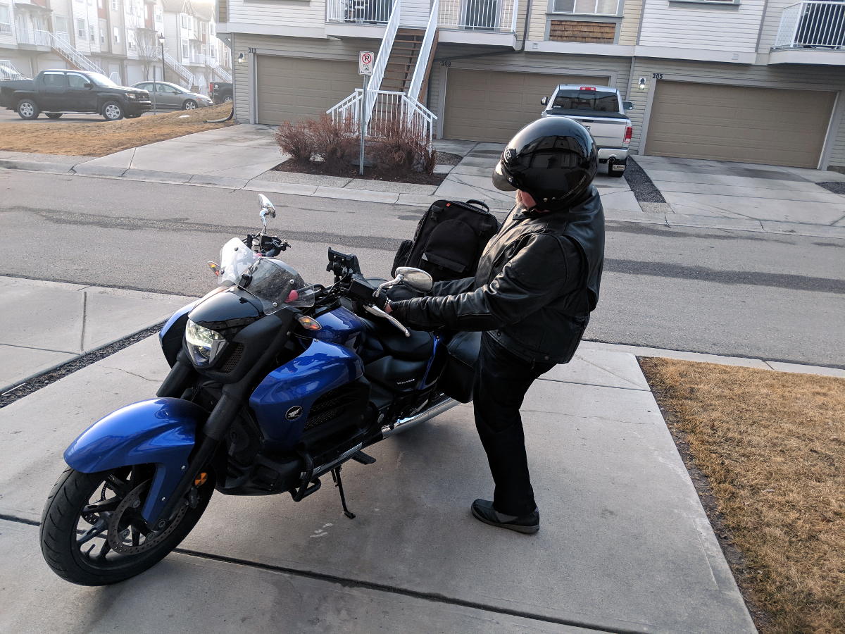 Kick your leg up over the seat