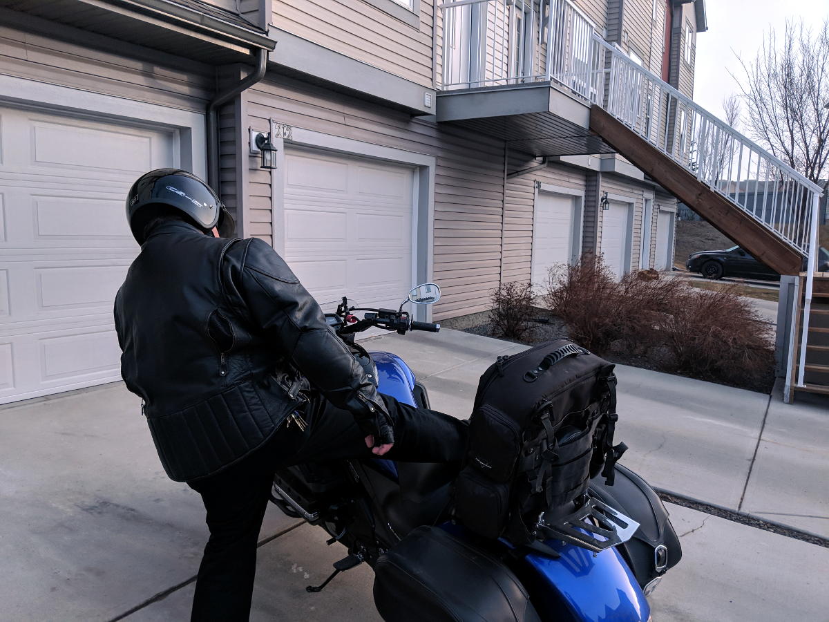 Kick your leg up over the seat