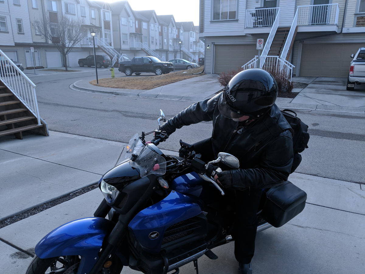 Kick mounting a motorcycle