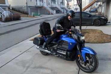 Kick mounting a motorcycle