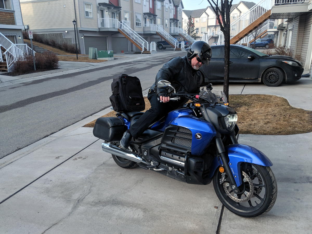 Kick mounting a motorcycle