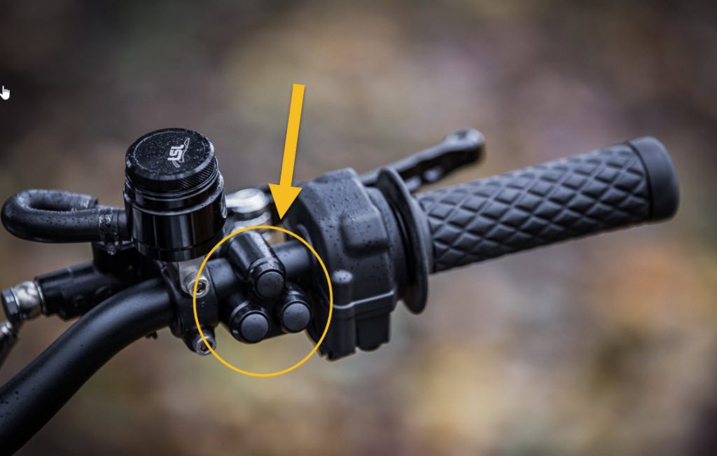 Motorcycle momentary pause switch