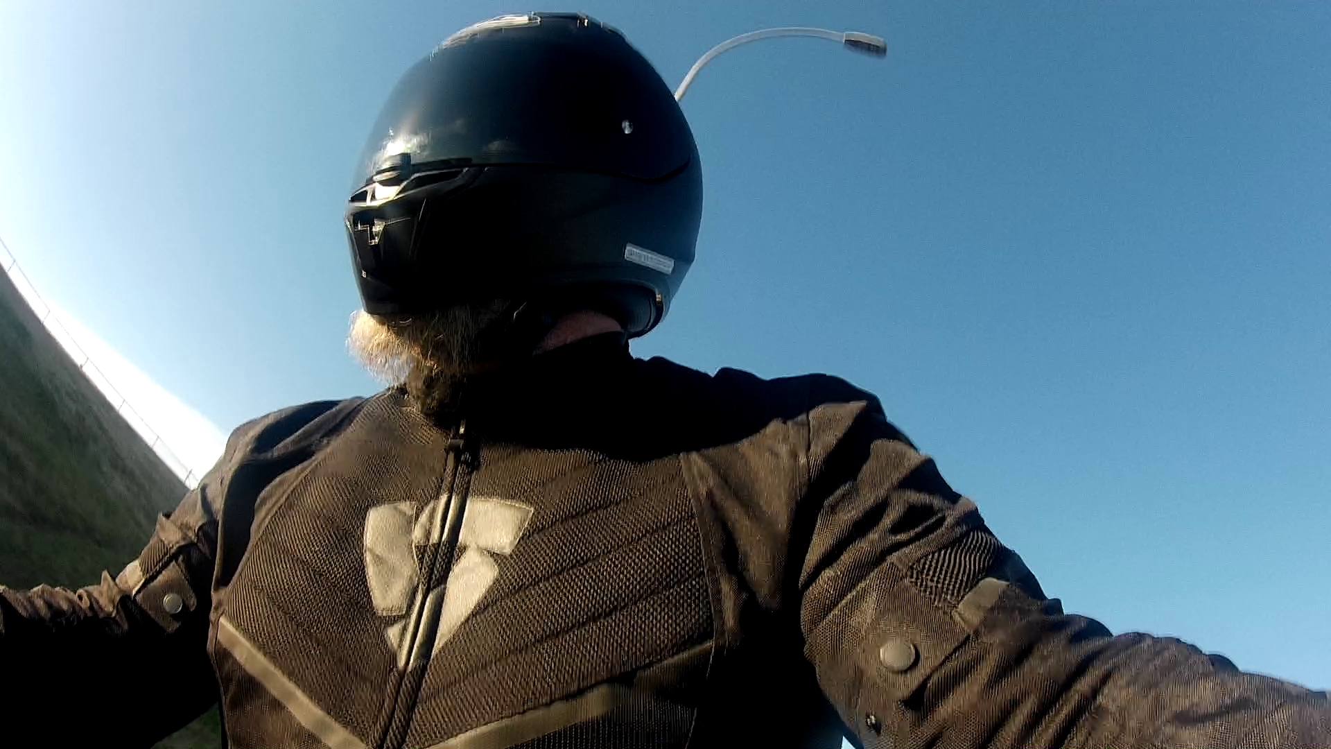Author wearing full face helmet and textile jacket as beginner motorcyclist