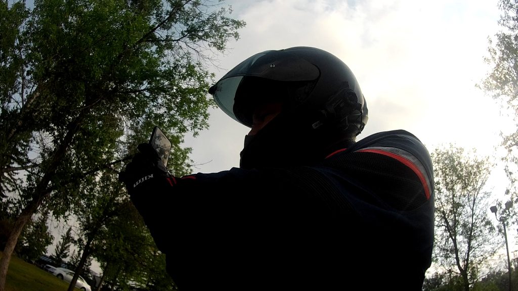 Author pulled over on bike to check messages on phone