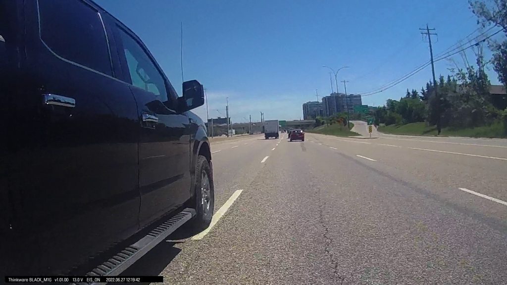 View of truck merging into author's lane
