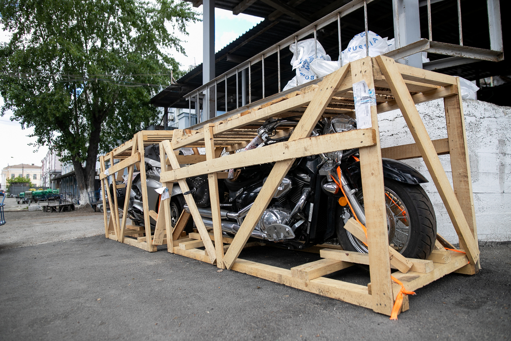 Motorcycles in open air crates