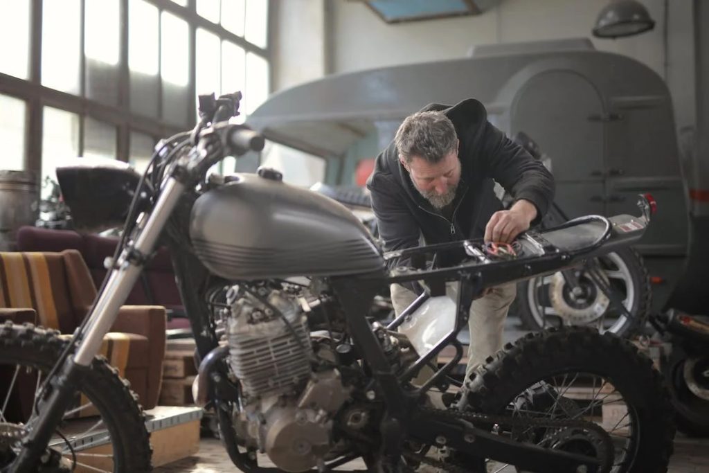 Man working on motorcycle