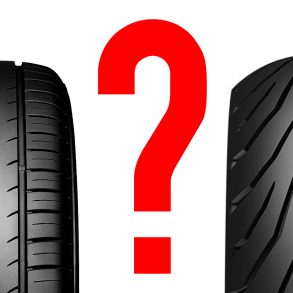 A car tyre and a motorcycle tyre separated by a question mark