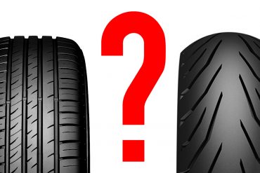 A car tyre and a motorcycle tyre separated by a question mark