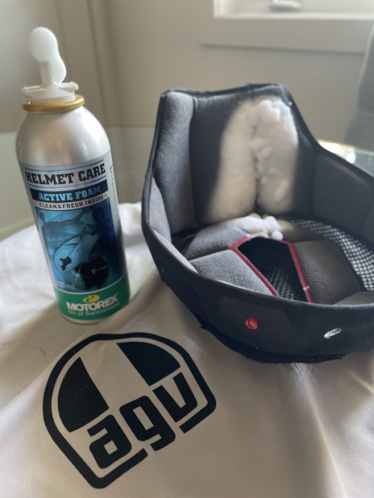 Helmet liner removed from full-face motorcycle helmet for cleaning