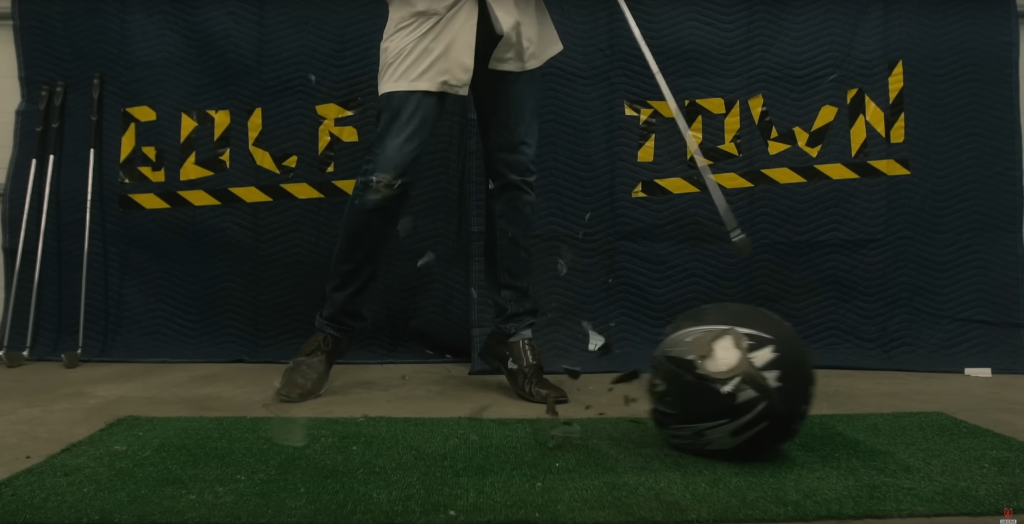 Hitting a cheap knock-off helmet with a golf club